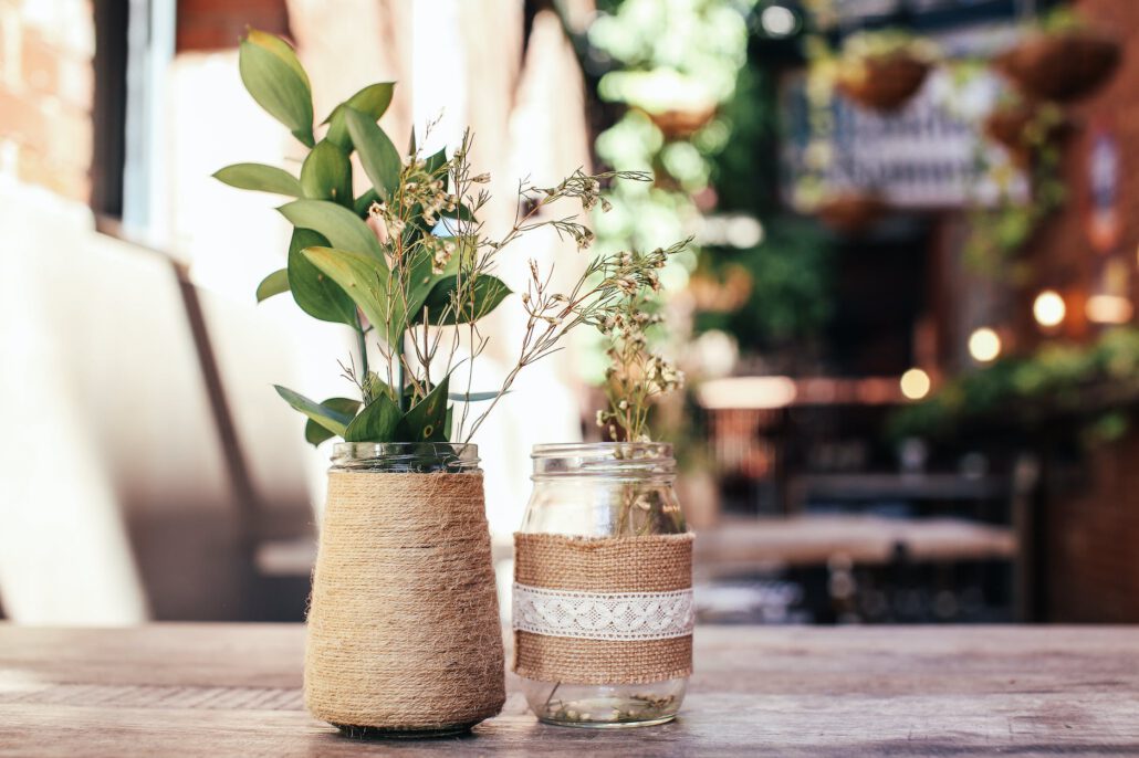 vases with flowers in cafe