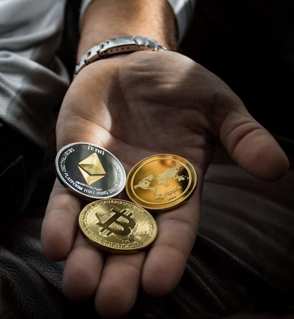 closeup photo of three round coins in person s palm